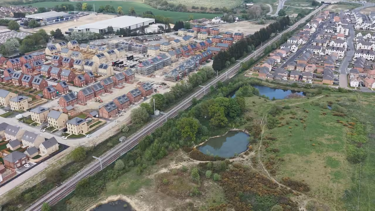 Aerial overview of a UK new-build housing development