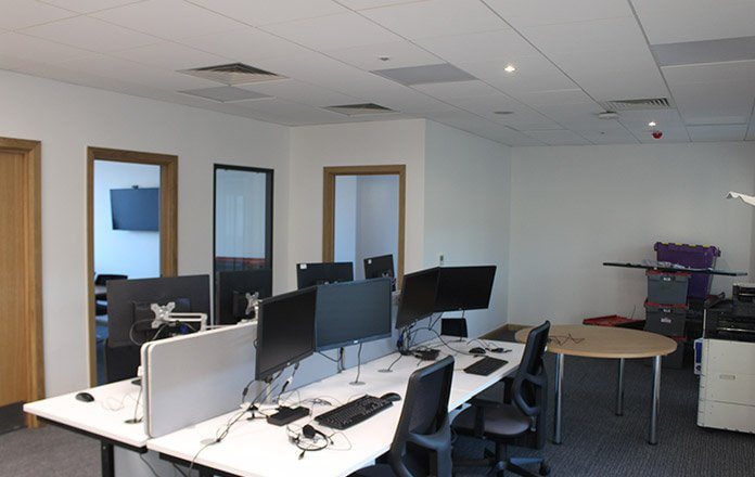 Fitted office space with workstations and monitors  -  The Catalyst