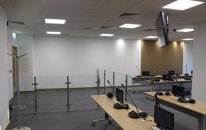 Meeting room with conference table and AV screens  -  The Catalyst