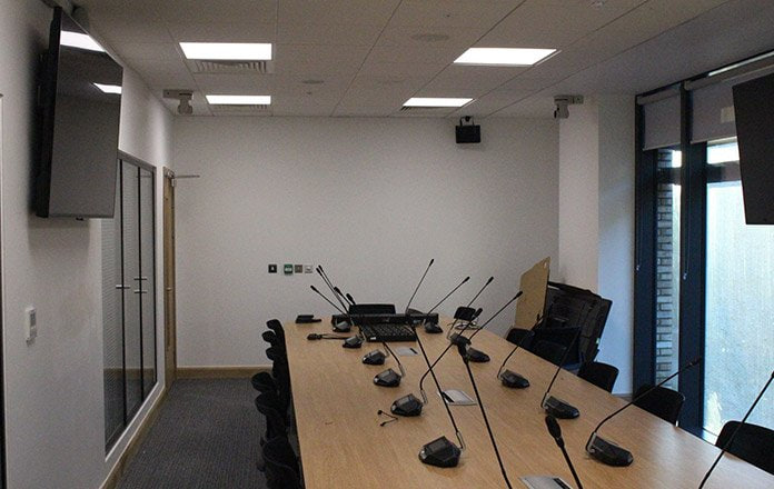 Boardroom with long table and integrated microphone system  -  The Catalyst