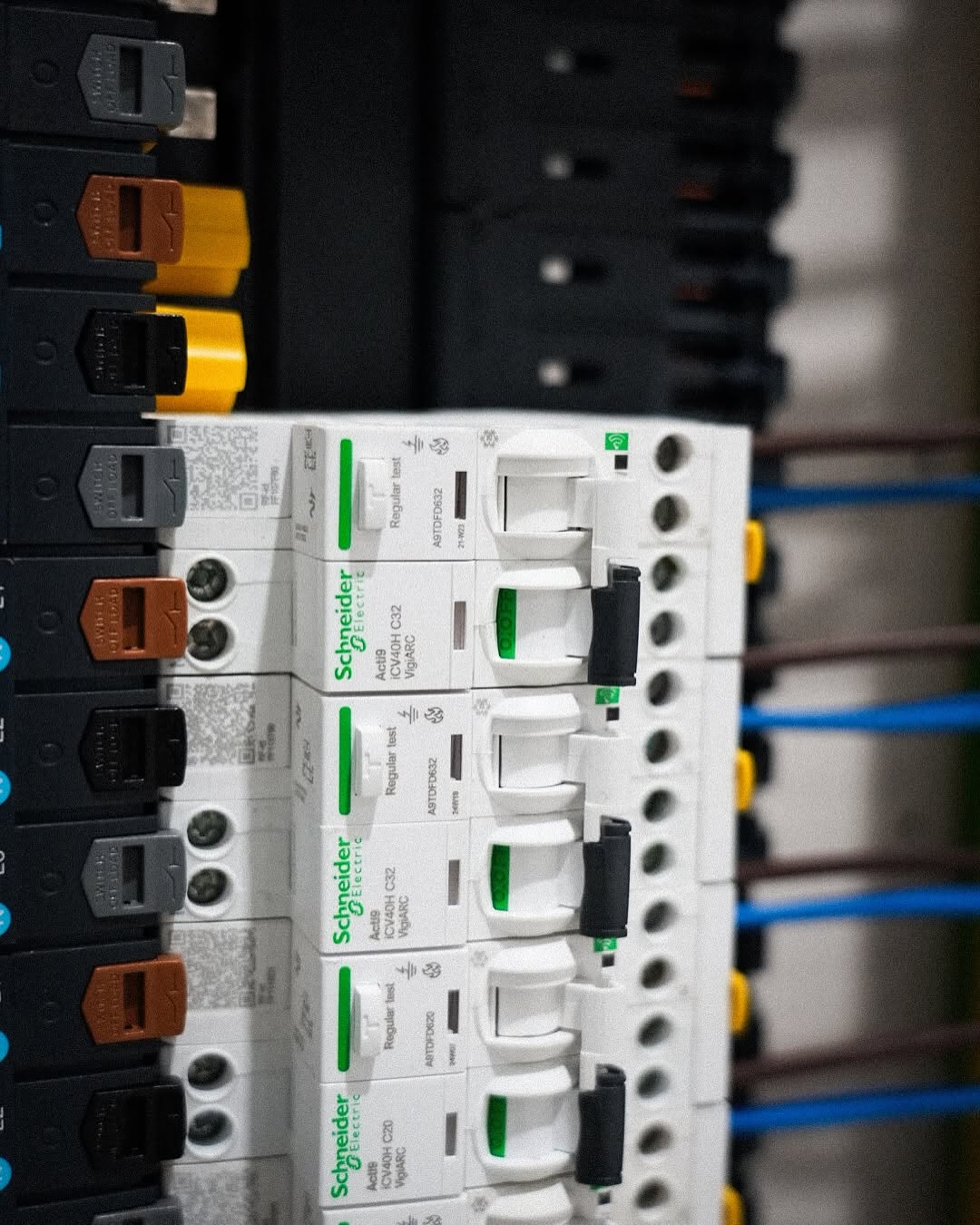 Close-up of Schneider Acti9 iCV40H VigiARC arc fault detection RCBOs  -  commercial DB fitout